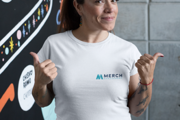 t-shirt-mockup-featuring-a-happy-customer-standing-by-an-art-wall-26210